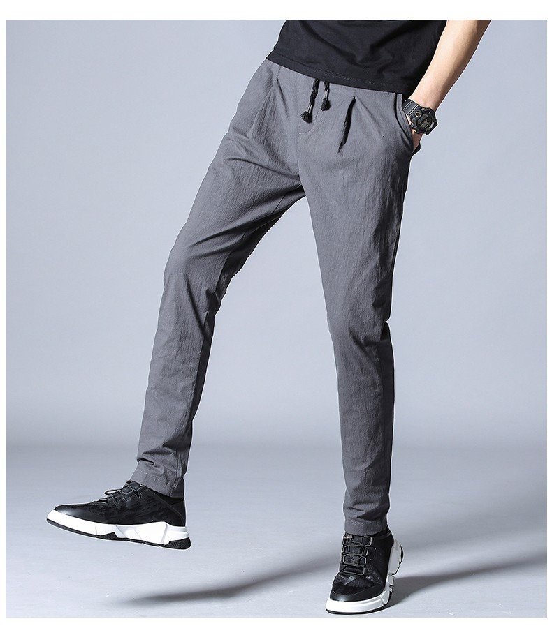 牧西登 男士休闲裤修身夏季新款时尚小脚棉料男生长裤 黑色 32码//2尺