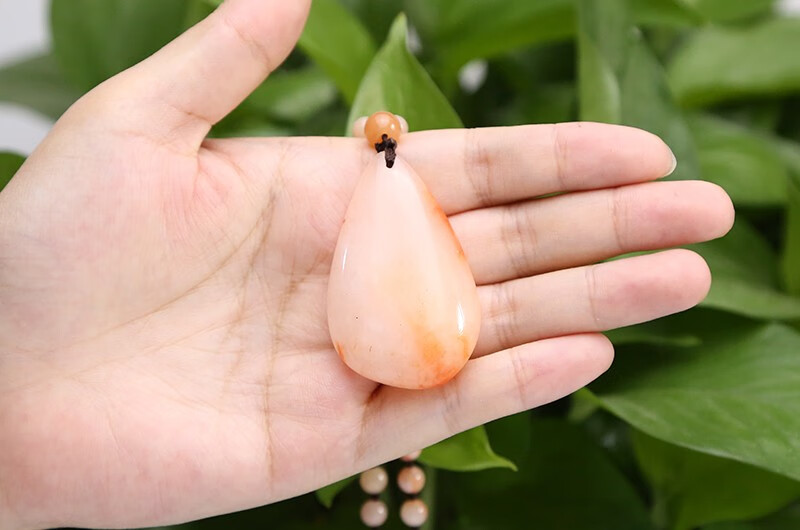 新疆天然金丝玉/红白色/随形地表籽料原石水滴吊坠/挂件