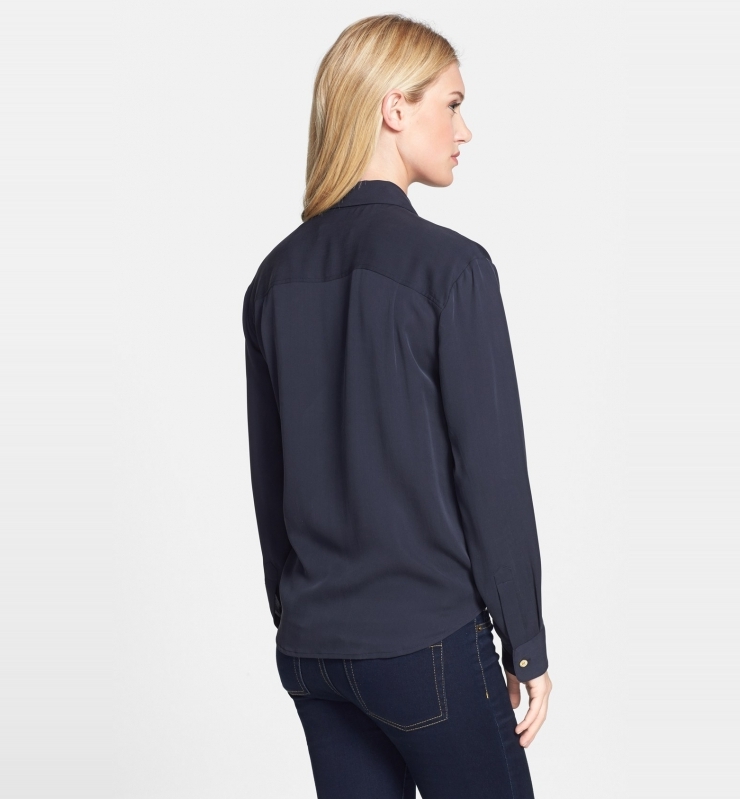 lustrous silk and gleaming golden buttons elevate a classically