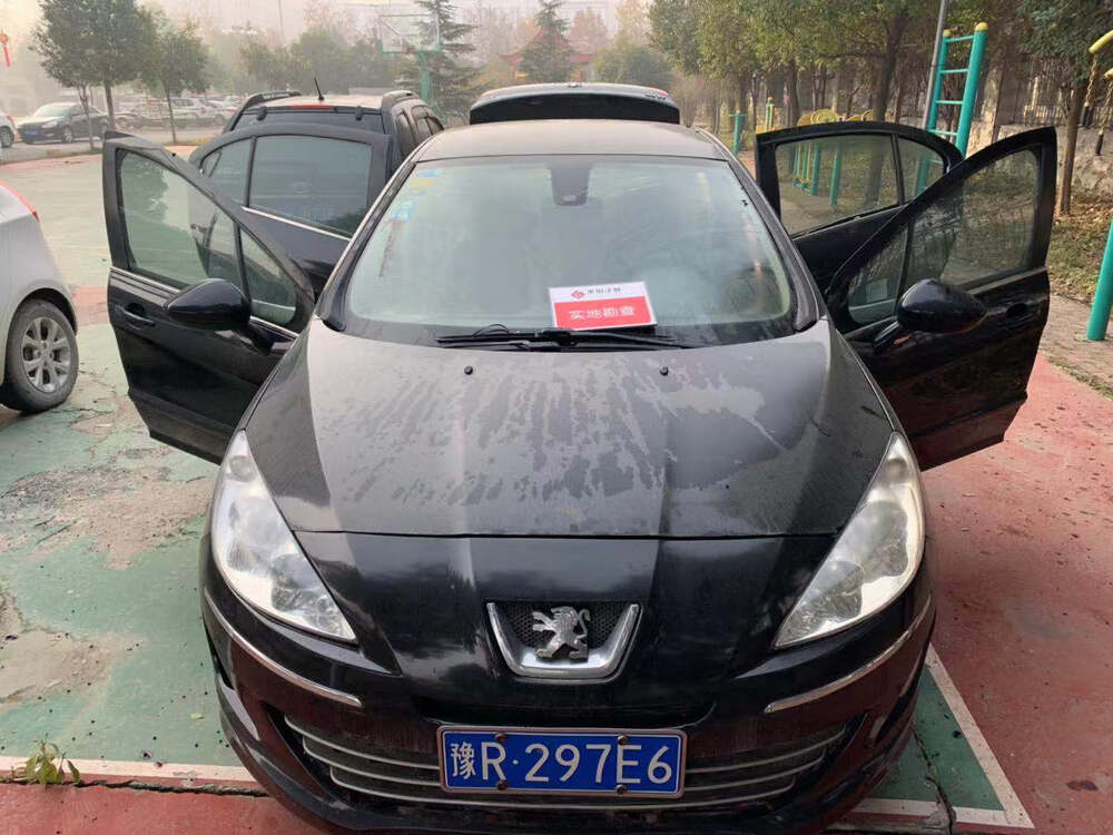 车牌号为豫r297e6东风标致牌机动车一辆