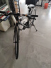 永久公路自行车700c前后碟刹男女式成人学生直把城市休闲通勤车 24速700C钢架线碟平把 幻影黑 实拍图