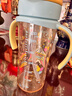 贝亲（Pigeon）自然成长翻盖直饮吸管 大童奶瓶330ml 马戏团 18月+ AA279 实拍图