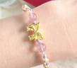 中国黄金（CHINA GOLD）黄金手链女足金蝴蝶结玛瑙手绳在逃公主编织情人节生日礼物送女友 【京速达】蝴蝶结草莓晶【粉手绳】约0.3g 实拍图