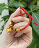 中国黄金（CHINA GOLD）小胖福黄金手链男女足金坨坨手绳宝宝周岁生日满月礼物送儿童婴儿 如意小胖福手绳【B款红绳】约0.5g 实拍图