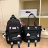 小鱼仙倌（XIAOYUXIANGUAN）书包小学生女生初中生减负两件套高中大学生大容量高颜值双肩包潮 黑色+徽章狗头挂饰 两件套书包 实拍图