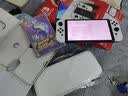 任天堂（Nintendo）NS OLED游戏机家用体感游戏机日版/港版任天堂SWITCH OLED游戏机 七夕礼物 Switch OLED（白色）＋宝可梦 紫 港版 实拍图
