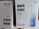 美的（Midea）冲牙器洗牙器 牙齿冲洗器伸缩便携式  出差旅行小巧便携清洁洁牙器 CS3蓝色 节日生日情侣礼物 实拍图
