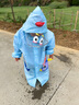 牧萌 儿童雨衣男女童带书包位宝宝幼儿园小学生雨鞋套装防水卡通雨披 浅蓝火箭恐龙 L码（建议身高105-115cm） 实拍图