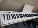 爱里森（ANYSEN）电子琴折叠琴88键初学者儿童成人家用专业版便携式键盘琴电子钢琴 标准款白色+琴架+大礼包 实拍图