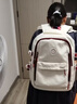 回力书包学生女新款初中生高中生大容量背包简约双肩包宽肩带书包轻便 白配红【升级款+冲天鸭挂件】 实拍图