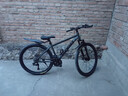 凤凰（Phoenix）山地车自行车成年人男女学生铝合金禧玛诺变速减震油碟山地自行车 深灰/钢架/辐条轮/全轴承 24速进口禧玛诺/27.5寸 实拍图