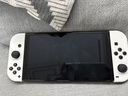 任天堂（Nintendo）【国内保税仓】Switch2/1代 OLED/续航加强日版/港版便携家用ns体感游戏掌机 日版OLED白色+双人成行+Pro黑色手柄(保税仓 实拍图