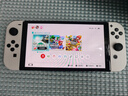 任天堂（Nintendo）Switch OLED日版/港版游戏机续航加强版ns体感掌机便携家用主机 港版OLED白色64G保税（赠2年VIP会员） 实拍图