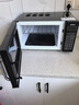 格兰仕（Galanz）【国家补贴】微波炉烤箱一体机光波20L家用700W节能平板易清洁智能菜单多功能小型烧烤解冻预约DG 全新机器 实拍图