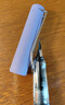 英雄（HERO）钢笔 369热可擦 明尖铱金学生练字三年级正姿签字钢笔（附加10支墨囊+4卡通配件） F尖 珠光蓝 实拍图