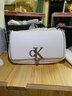 Calvin Klein时尚单肩包礼物链条包包金属字母旋扣翻盖CK女包斜挎马鞍包 YAF-牛乳白 OS 实拍图