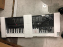 美科（Meirkergr）MK-975（智能版） 亮灯跟弹61键钢琴键多功能智能电子琴乐器 连接U盘手机pad带琴架 实拍图