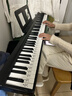 特伦斯电子琴88键折叠琴成人儿童初学电钢键盘教学乐器V10便携钢琴 典雅黑+原装琴包+Z型琴架 实拍图