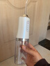 日本进口电动冲牙器家用洗牙器口腔牙齿深度清洁专用便携式水牙线 【极光白】升级版 1支喷头 全身防水/高压脉冲 实拍图