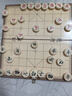 得力（deli）中国象棋套折叠棋盘朋友聚会儿童益智娱乐入门套装标准原木色棋子 实拍图