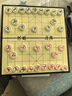 得力（deli）磁性中国象棋生态荷木烫金学生儿童益智棋便携折叠防水 大号 实拍图