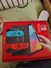 任天堂（Nintendo）【国内保税仓】Switch2/1代 OLED/续航加强日版/港版便携家用ns体感游戏机掌机 日版OLED红蓝+荒野之息+奥德赛(保税仓） 实拍图