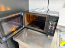 格兰仕（Galanz）变频微波炉烤箱一体机光波炉900瓦大功率速热家用23L大容量平板易清洁省电一级能效智能菜单烧烤 2026新升级彩膜BM1(S2) 实拍图