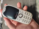 飞利浦（PHILIPS）学生专用手机精准定位视频通话小学初高中生戒网无游戏非智能电话手表老年人功能备用机 E6801白色 实拍图