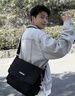 回力新款斜挎包男大容量百搭休闲帆布单肩包潮简约日系旅行学生背包女 黑色+太空人挂件 实拍图