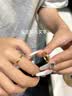 中国黄金（CHINA GOLD）黄金戒指男女足金莫比乌斯托帕石情侣对戒情人节生日礼物送男女友 【只为你闪亮】莫比乌斯【女戒】约1.5g+品牌礼盒 实拍图