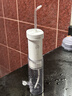 洁碧（Waterpik）冲牙器水牙线GS7-1便携式电动洁牙机手持式洗牙器家用立式预防牙结石正畸全身水洗 送母亲节礼物 GS7珍珠白【伸缩便携款】 10支喷头 实拍图