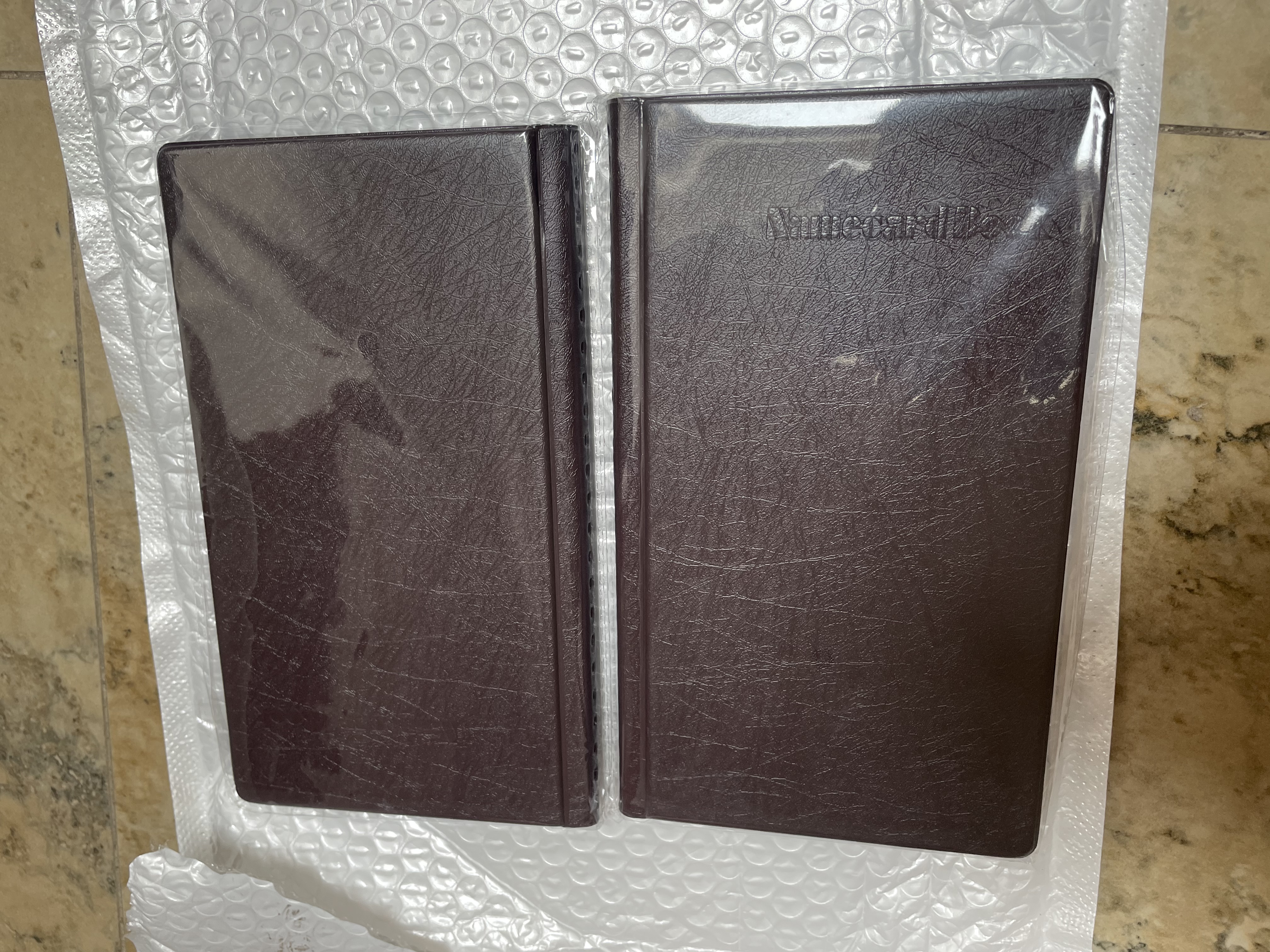 得力（deli）名片夹名片册大容量商务卡包证件包卡册火车票银行信用卡收纳男女名片办公用品 【棕色】可装180张名片 两本 实拍图