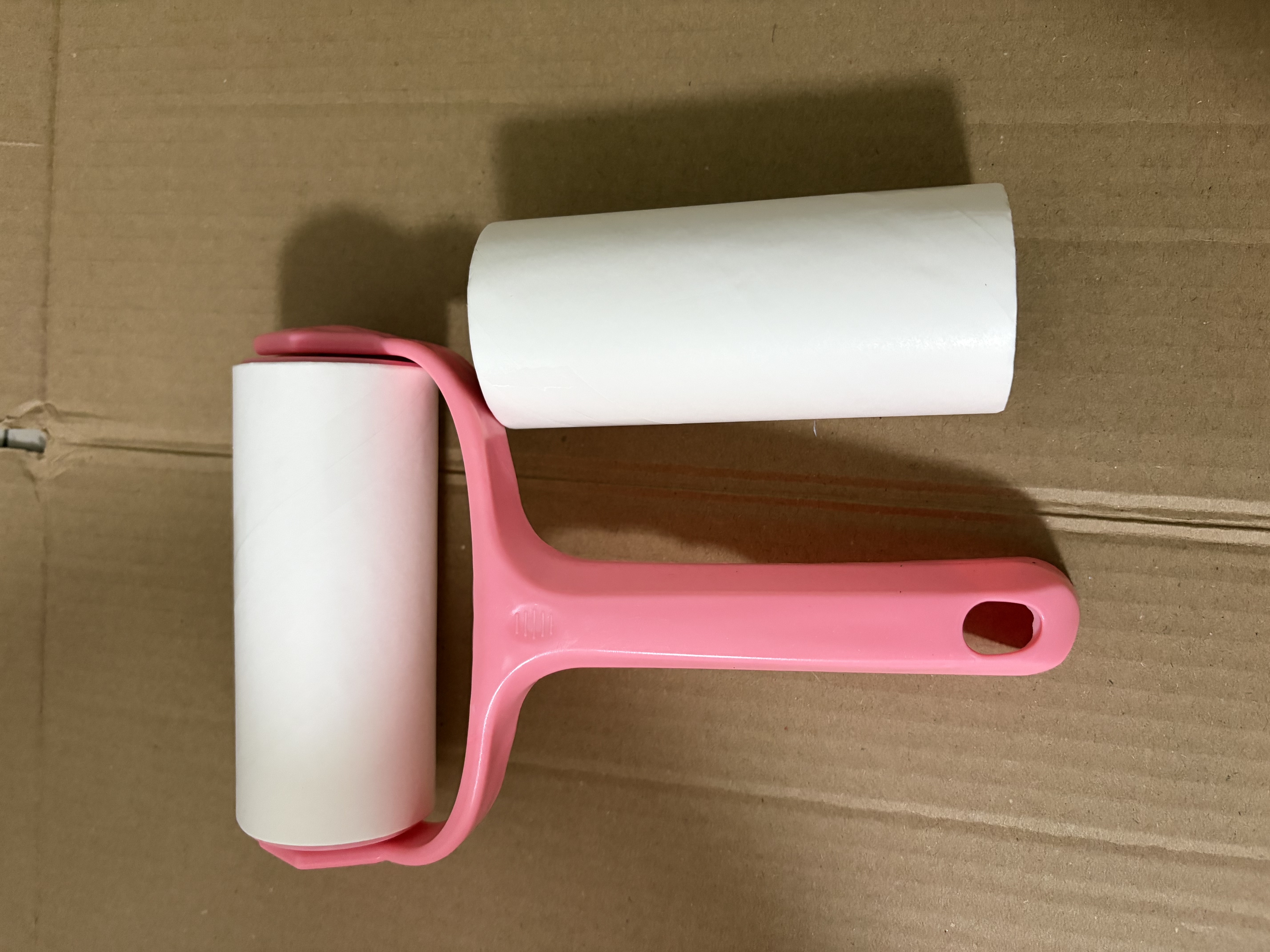 家用滚筒粘毛器可撕式粘尘纸滚刷替换卷纸除毛刷宠物去毛沾毛器 1器+2卷纸【共60撕】 实拍图