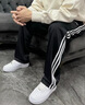 阿迪达斯（adidas）长裤男女春季宽松透气直筒裤跑步运动防风休闲裤  黑金 XL 实拍图