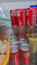 可口可乐（Coca-Cola）汽水 碳酸饮料 200ml*24罐  迷你摩登罐 新老包装随机发货 实拍图