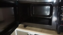 格兰仕（Galanz）变频微波炉烤箱一体机光波炉900瓦大功率速热家用23L大容量平板易清洁省电一级能效智能菜单烧烤 2026新升级彩膜BM1(S2) 实拍图