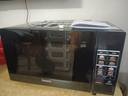 格兰仕（Galanz）变频微波炉烤箱一体机光波炉900瓦大功率速热家用23L大容量平板易清洁省电一级能效智能菜单烧烤 2026新升级彩膜BM1(S2) 实拍图
