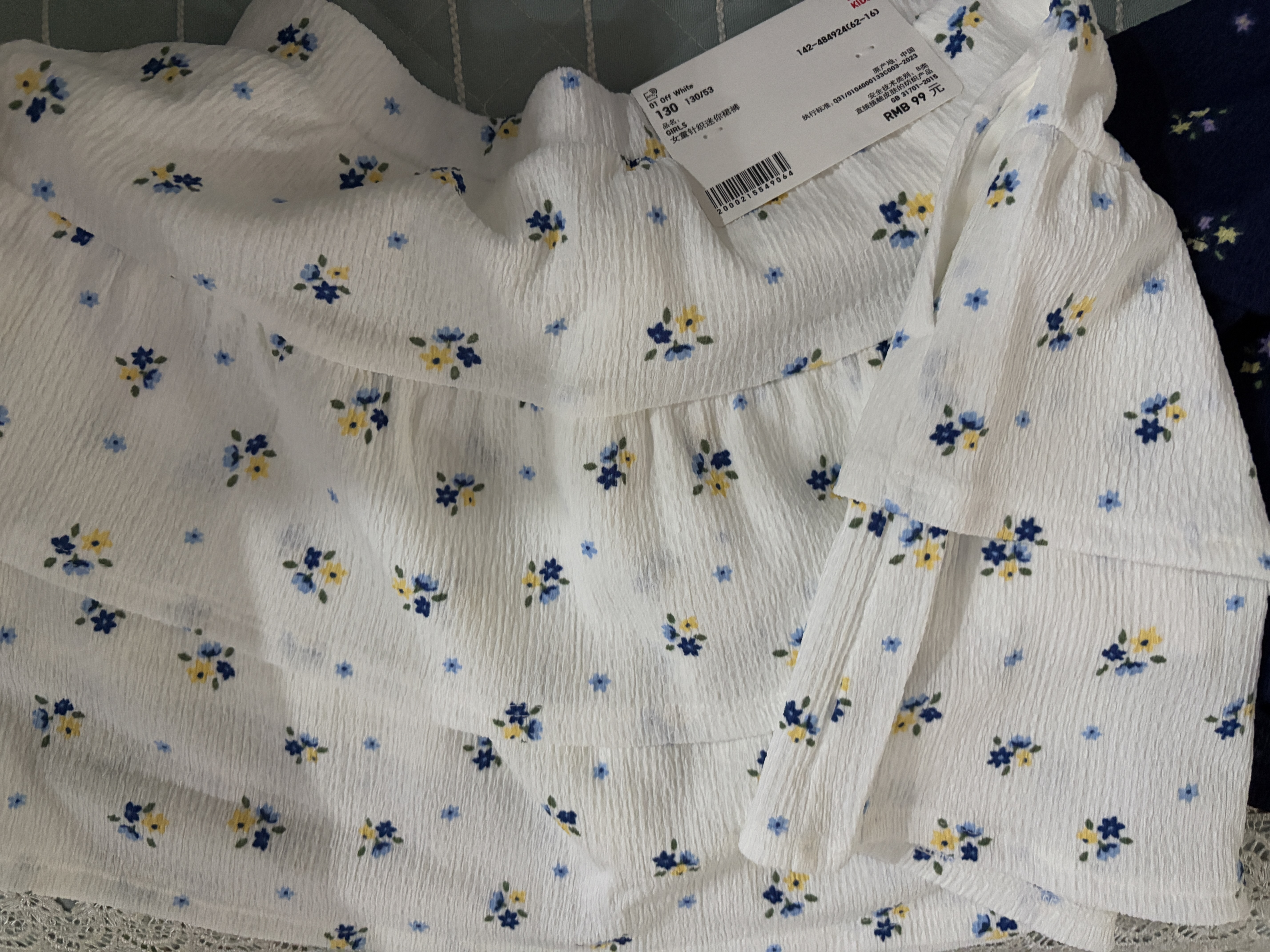 优衣库童装女童针织迷你裙裤短裙短裤半裙484924 01 乳白色 130 实拍图
