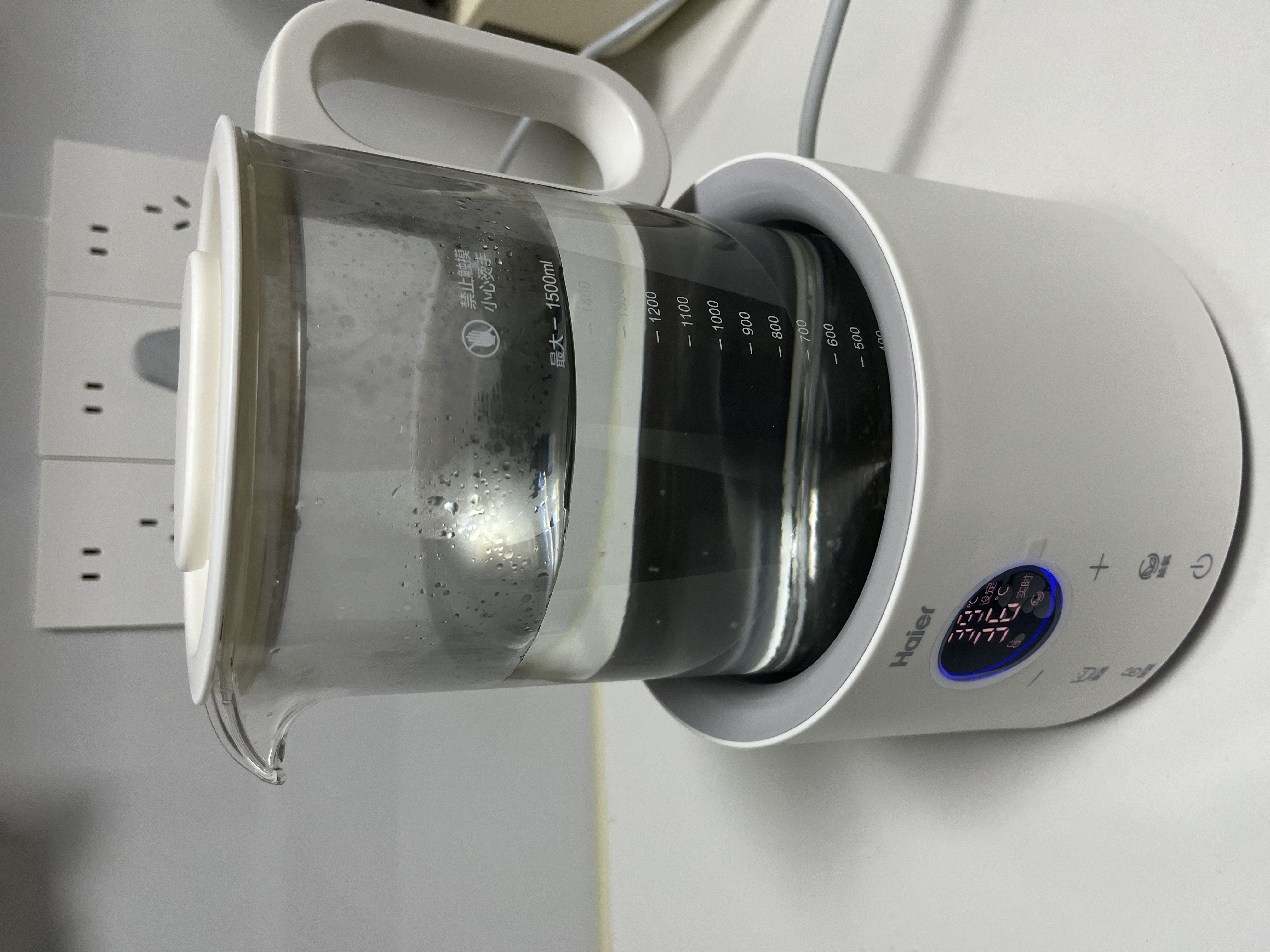 海尔恒温电热水壶1.5L 速热烧水壶煮茶壶冲泡奶粉调奶器 保温除氯不锈钢加热盘电热水壶H207白色 实拍图
