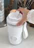 膳魔师（THERMOS）榨汁杯榨汁机小型便携水杯果汁机水杯一体家用果蔬充电果汁杯冰沙机奶昔机搅拌杯打汁随行杯冰霸杯 【长效制冷】冬雪白 实拍图