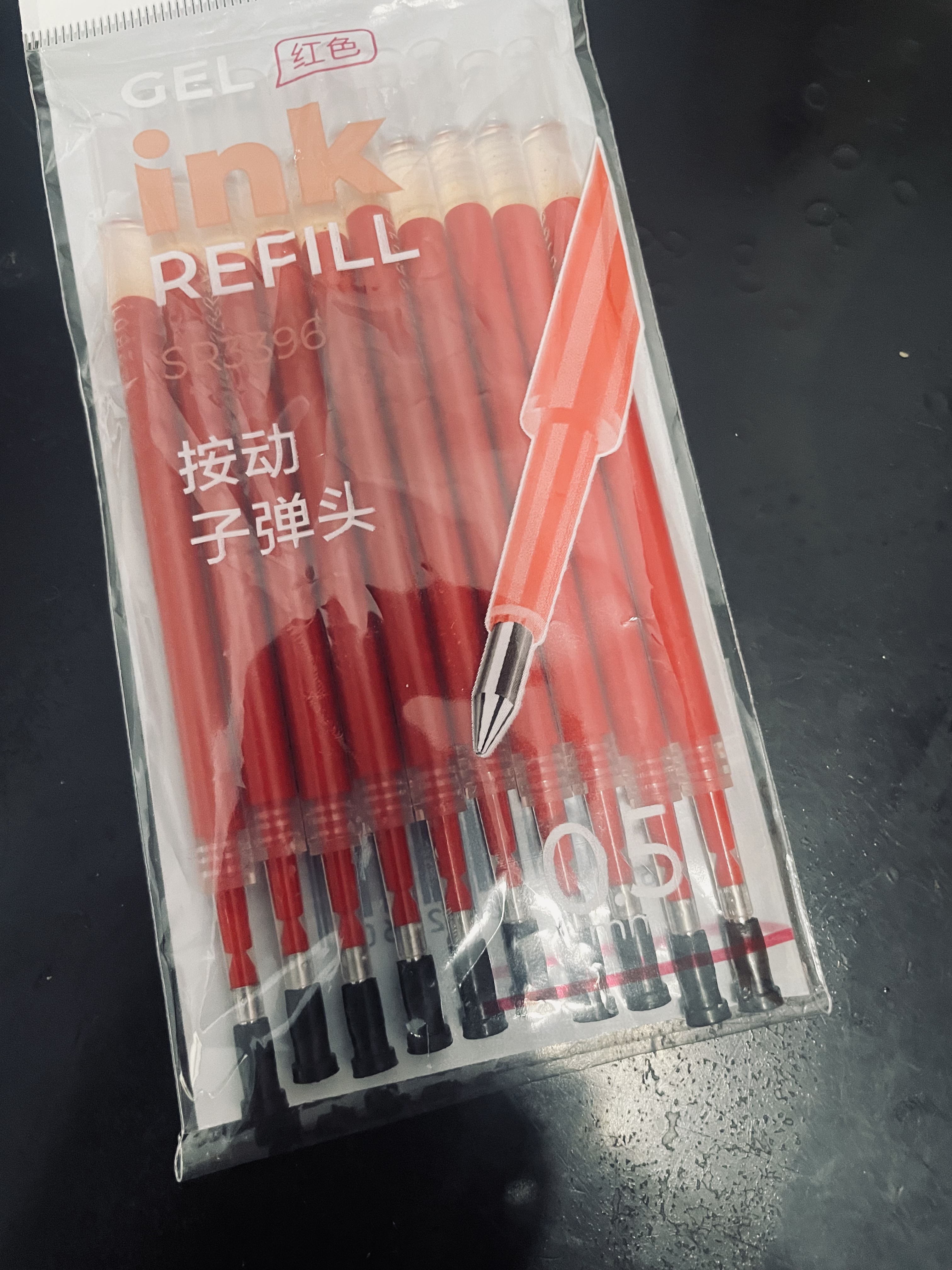得力（deli）0.5mm红色子弹头按动笔芯 学生中性笔教师顺滑红笔替芯 S01/S08/1008/K35适用 红色10支/袋SR3396 实拍图