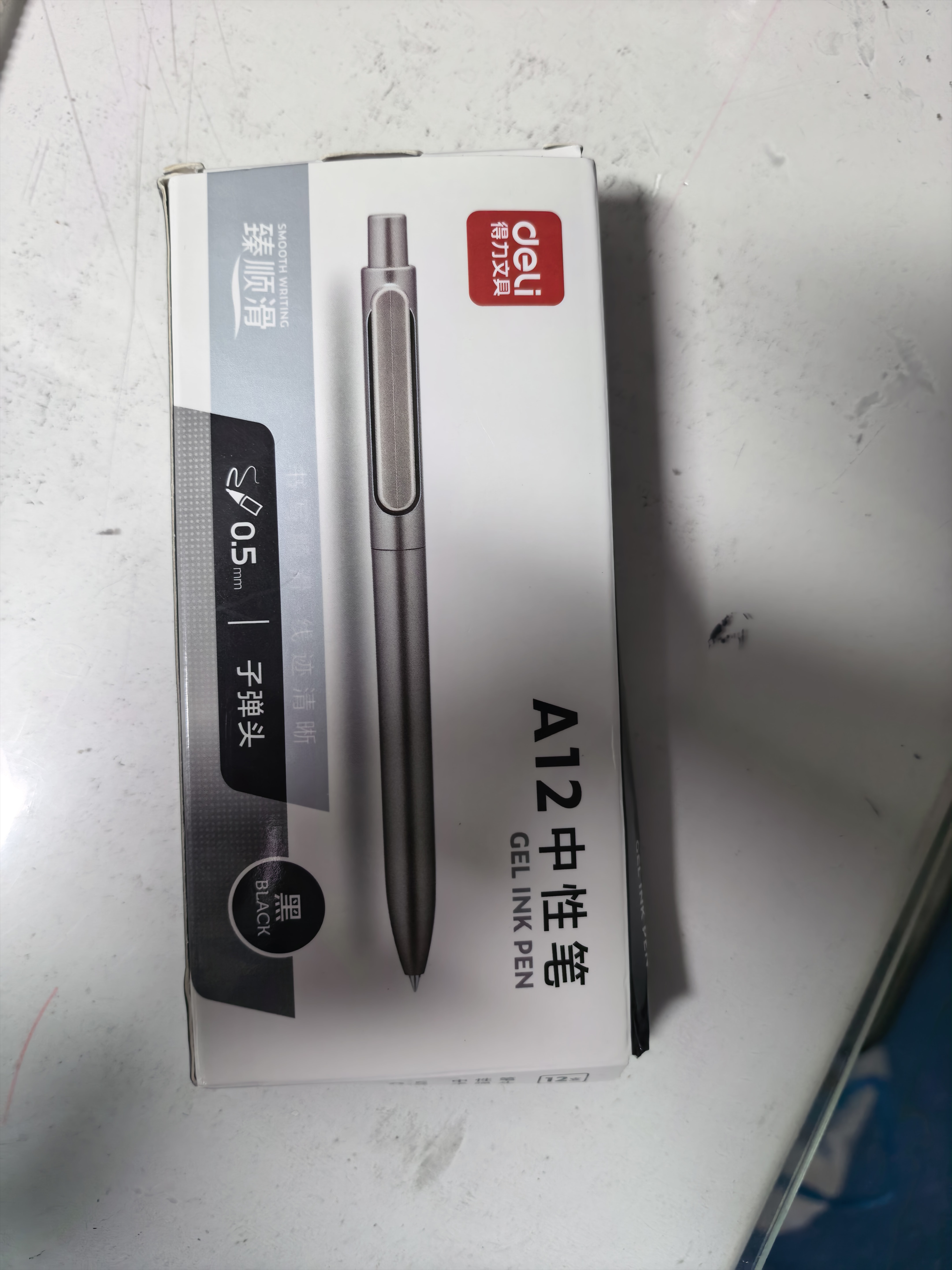 得力（deli）乐素臻顺滑按动中性笔签字笔 0.5mm子弹头按动笔水笔 金属喷漆 黑色 12支/盒A12高考考试 实拍图