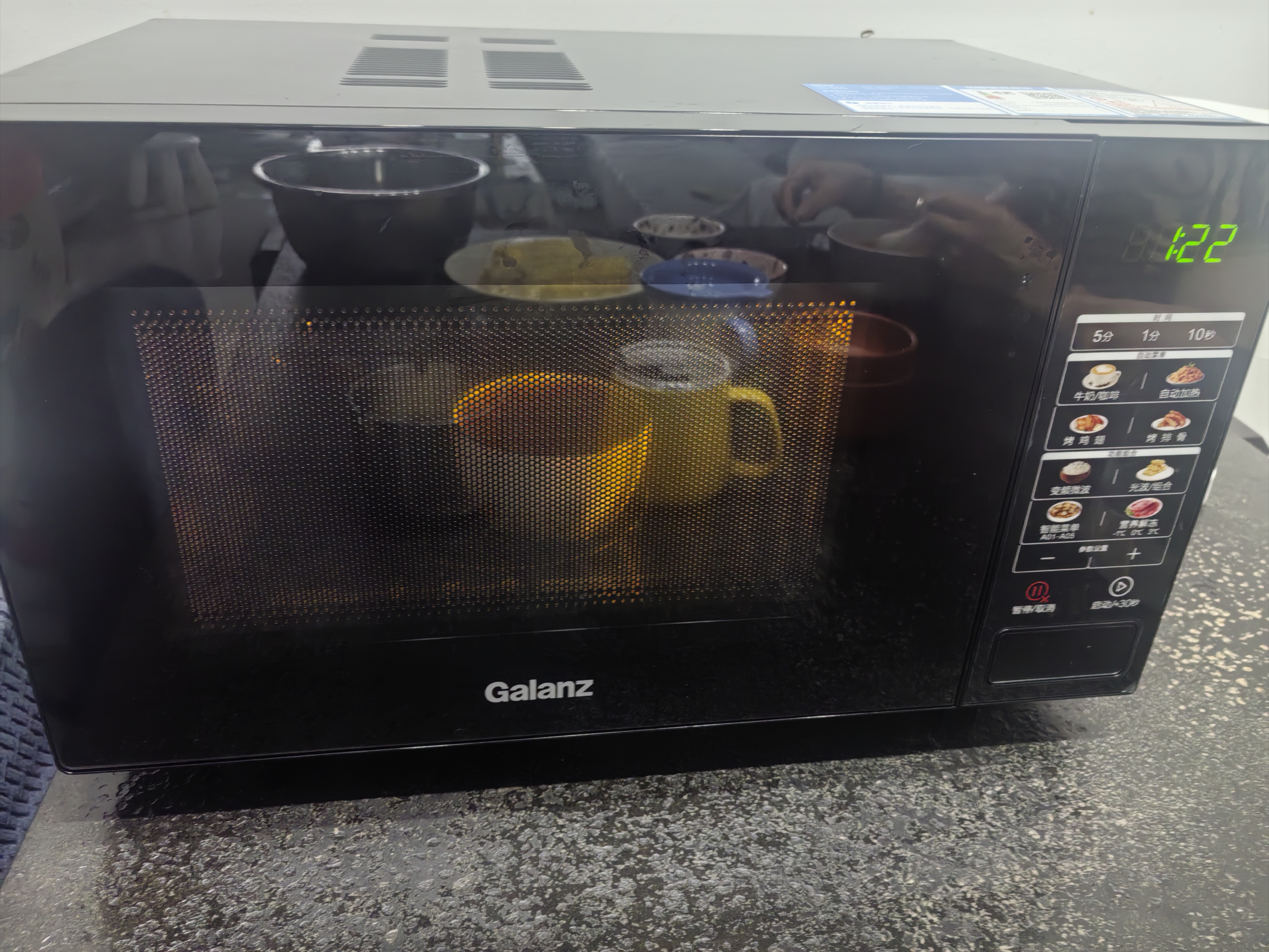 格兰仕（Galanz）变频微波炉烤箱一体机光波炉900瓦大功率速热家用23L大容量平板易清洁省电一级能效智能菜单烧烤 2026新升级彩膜BM1(S2) 实拍图