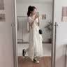 梵昇昱连衣裙长裙裙子女白色夏季2026新款法式掐腰显瘦海边沙滩裙高级感 米白荷叶裙 M 【80-100斤】 实拍图