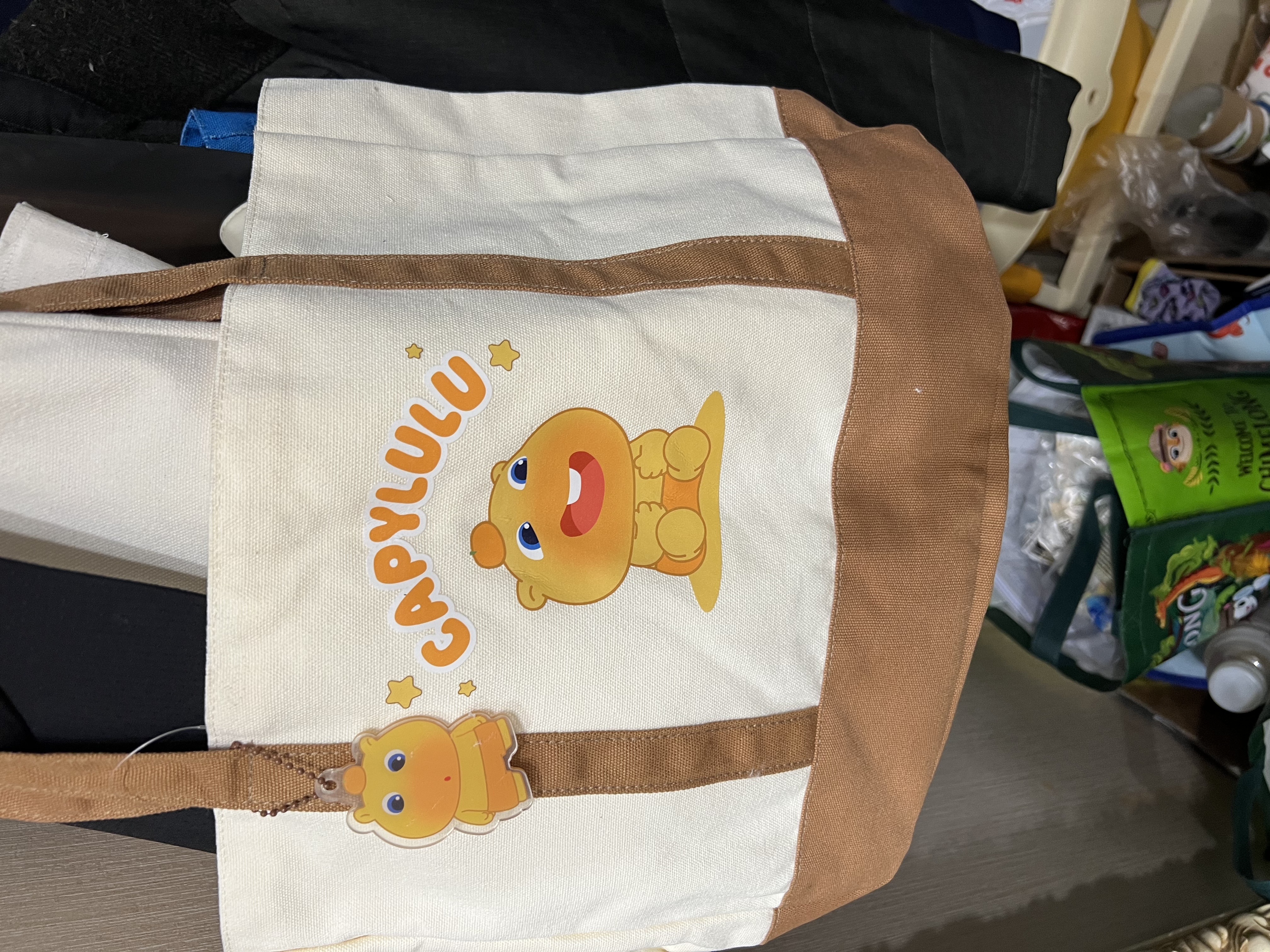 得力（deli）水豚噜噜休闲补习袋 大容量学生单肩包 补课画画出游出行收纳包 米色ST177开学文具礼物美术袋 实拍图
