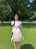 viney书包小学生初中高中大学生背包女大容量旅行双背包户外出游旅行包 白色+可爱挂件 简约轻便高颜值休闲减负电脑包 实拍图