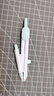得力（deli）绿色按动针脚学生圆规 按动出针保护针脚使用安全绘图精准学生圆规最大直径28cm金属圆规0.5mm铅芯 实拍图