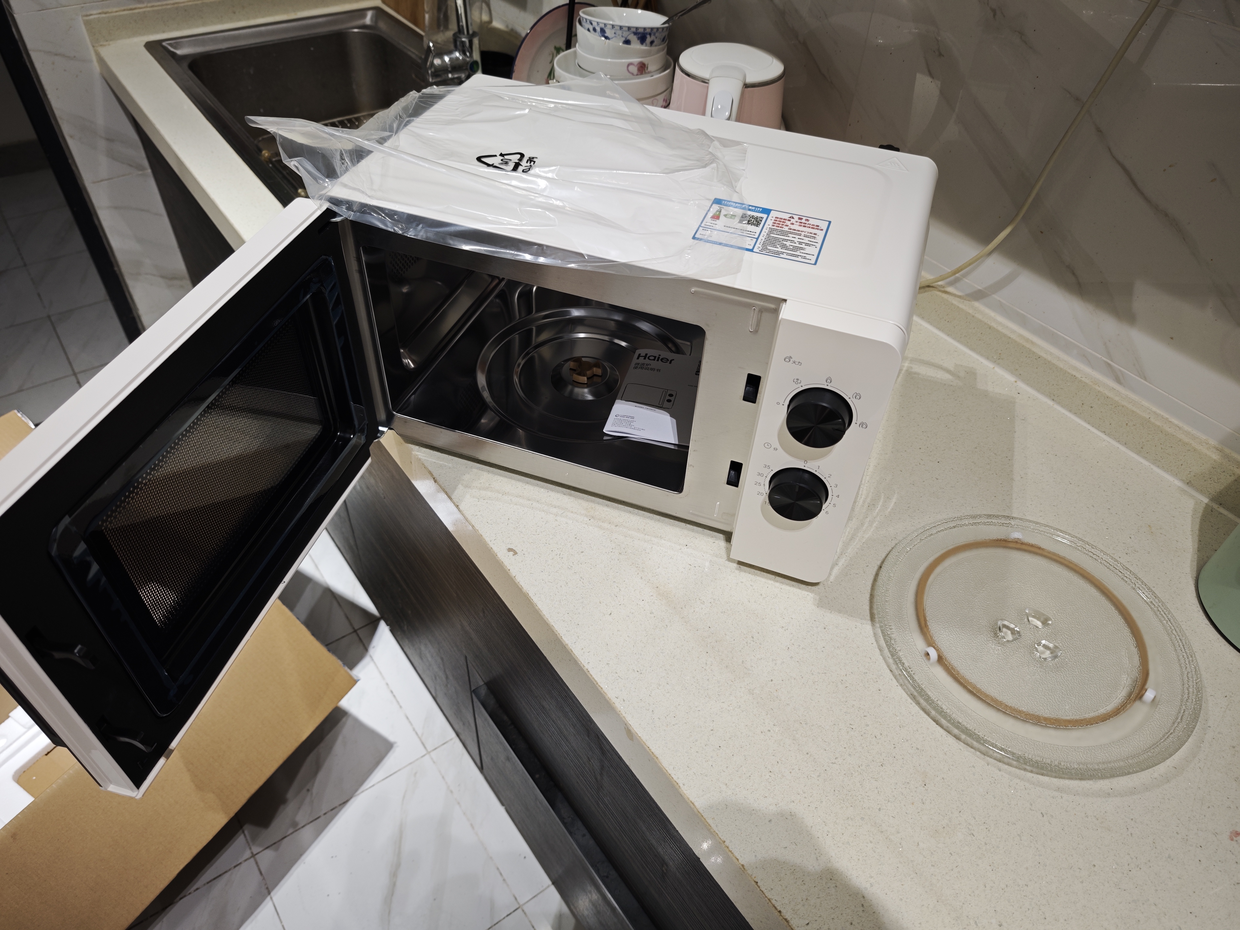 海尔（Haier）白巧不锈钢微波炉 0涂层360°转盘加热 旋转操作易洁耐用内胆 家用小型 老人适用 HW-M2003JW 实拍图