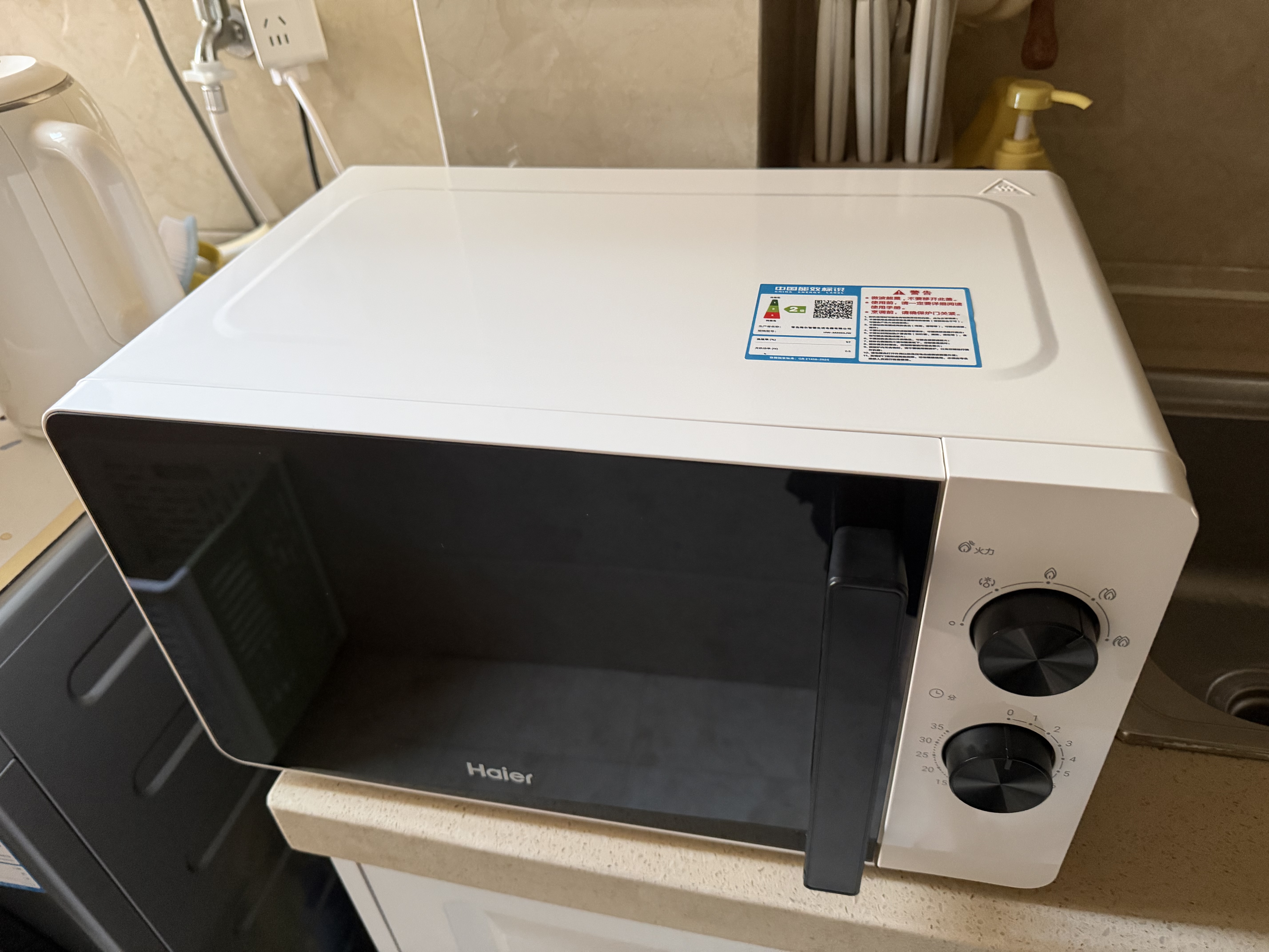 海尔（Haier）白巧不锈钢微波炉 0涂层360°转盘加热 旋转操作易洁耐用内胆 家用小型 老人适用 HW-M2003JW 实拍图