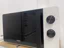 海尔（Haier）白巧不锈钢微波炉 0涂层360°转盘加热 旋转操作易洁耐用内胆 家用小型 老人适用 HW-M2003JW 实拍图